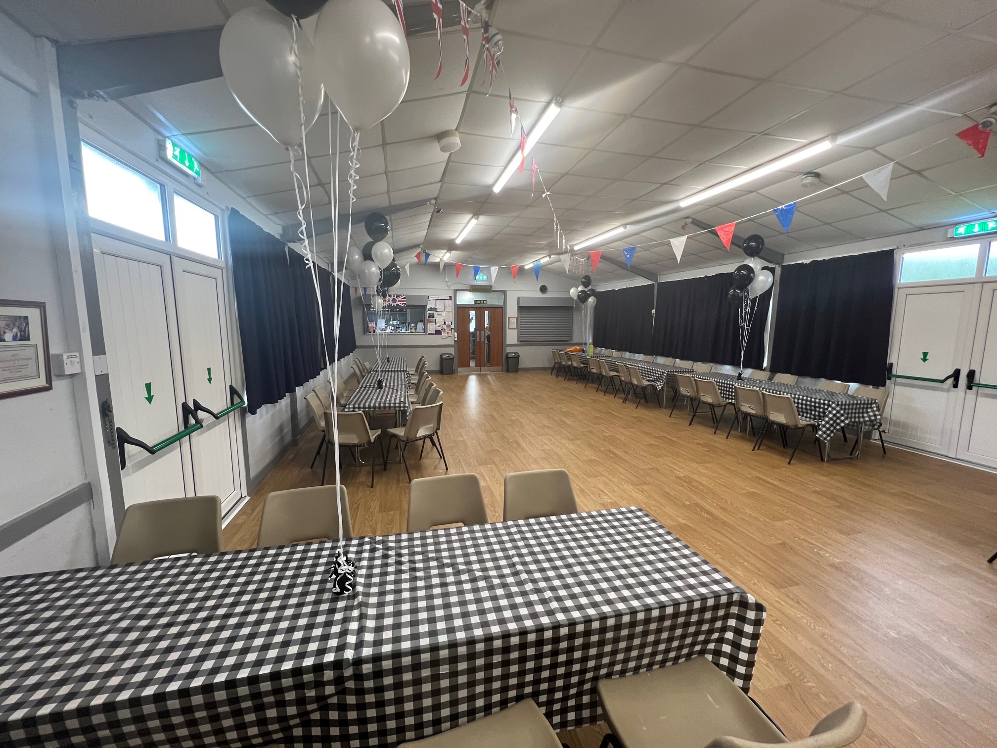 Daverson Hall set up with tables and decorations for a celebration